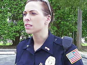 Female cops entice over black suspect and suck his blarney