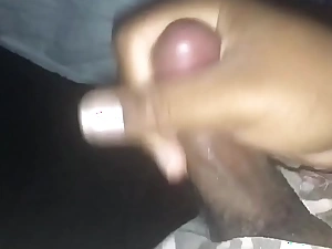 Small black cock jerking off